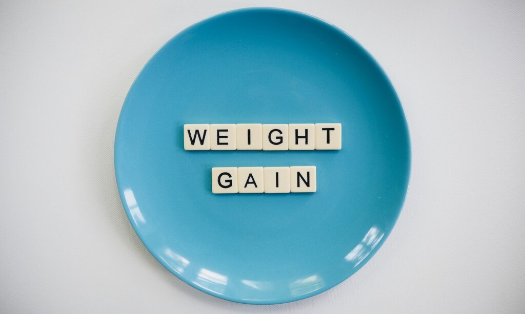 'weight gain' spelled out on a plate